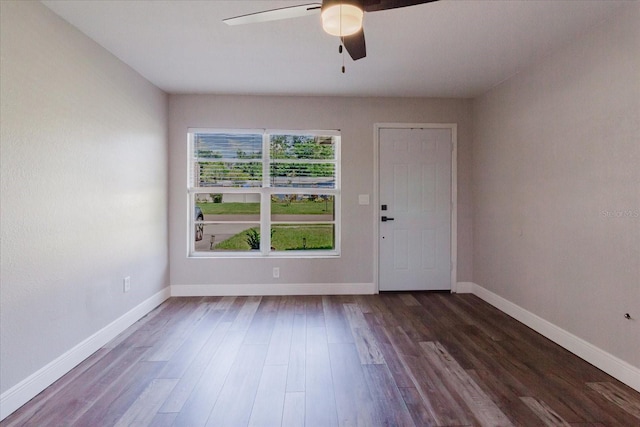 706 E Gate Dr, Safety Harbor, FL 34695 - empty room with dark wood-style flooring and a ceiling fan