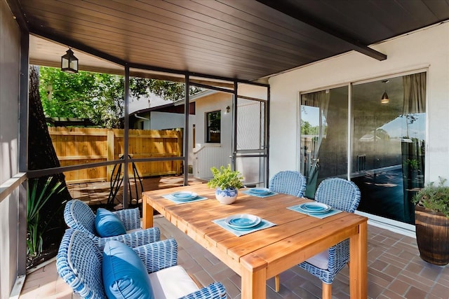 706 E Gate Dr, Safety Harbor, FL 34695 - sunroom featuring outdoor dining space