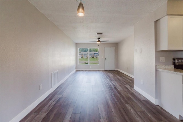 706 E Gate Dr, Safety Harbor, FL 34695 - unfurnished dining area with dark wood-style floors and ceiling fan