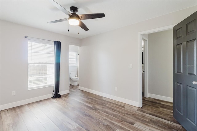 706 E Gate Dr, Safety Harbor, FL 34695 - empty room with wood finished floors and a ceiling fan