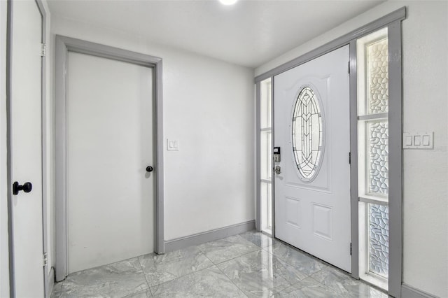 6200 13th Ave, New Port Richey, FL 34653 - foyer with light marble finish flooring and healthy amount of natural light