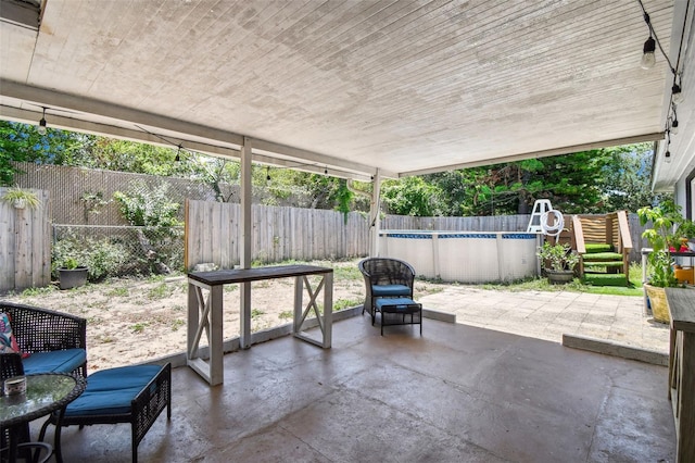 6200 13th Ave, New Port Richey, FL 34653 - fenced backyard featuring a patio area