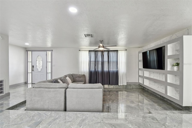 6200 13th Ave, New Port Richey, FL 34653 - living area featuring marble tiled flooring, a textured ceiling, ceiling fan, and recessed lighting