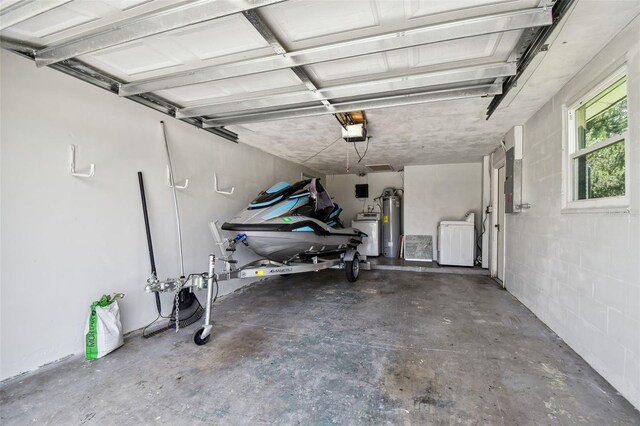 6200 13th Ave, New Port Richey, FL 34653 - garage with independent washer and dryer, electric panel, water heater, and a garage door opener