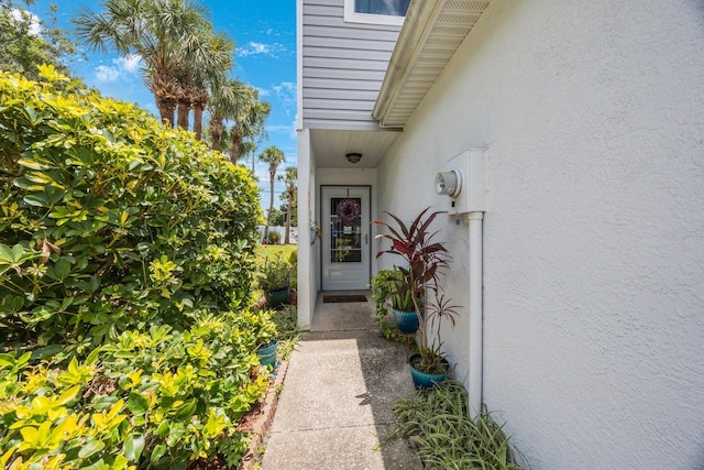 9205 Jakes Path, Largo, FL 33771 - property entrance with stucco siding