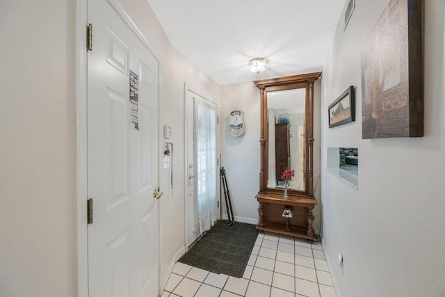 9205 Jakes Path, Largo, FL 33771 - foyer featuring light tile patterned flooring and baseboards