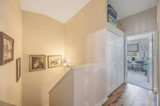 9205 Jakes Path, Largo, FL 33771 - hallway featuring a desk, wood finished floors, and lofted ceiling