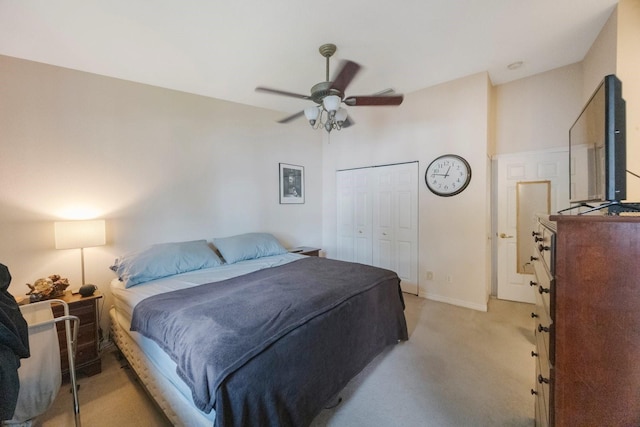 9205 Jakes Path, Largo, FL 33771 - bedroom with light carpet, a ceiling fan, and a closet