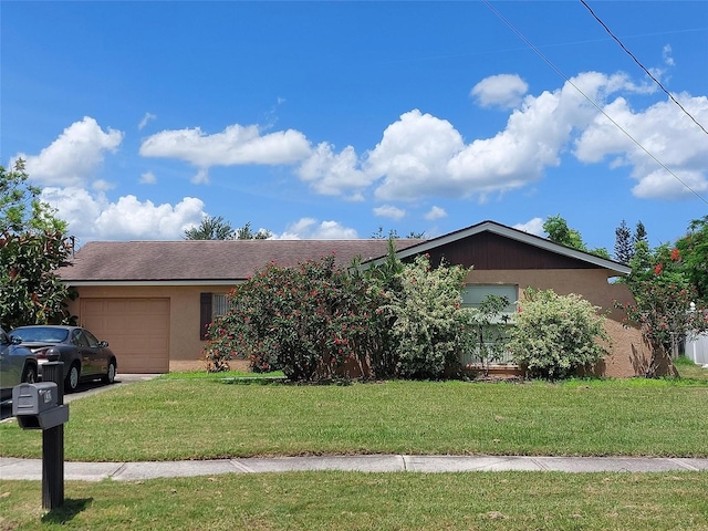 432 Flamingo Dr, Apollo Beach, FL 33572 - ranch-style home featuring an attached garage, stucco siding, and a front yard