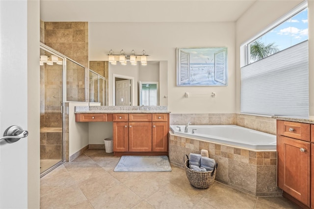 4911 Rock Island Ct, Wimauma, FL 33598 - full bathroom with a stall shower, vanity, and a garden tub