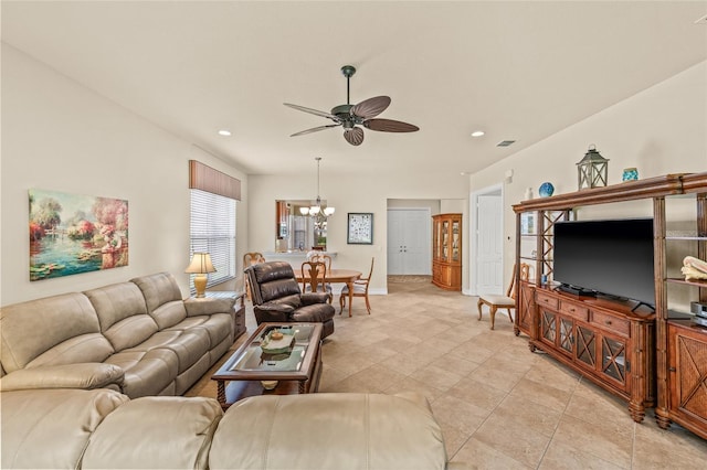 4911 Rock Island Ct, Wimauma, FL 33598 - living room featuring a ceiling fan, a chandelier, light tile patterned floors, and recessed lighting