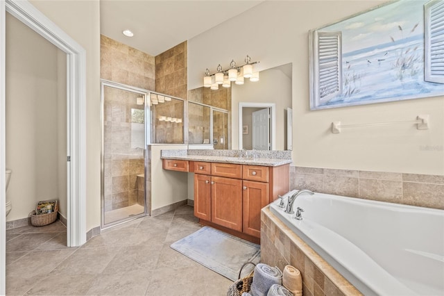 4911 Rock Island Ct, Wimauma, FL 33598 - full bathroom featuring vanity, a garden tub, a shower stall, and tile patterned flooring