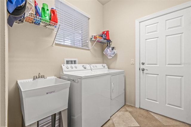 4911 Rock Island Ct, Wimauma, FL 33598 - laundry area featuring separate washer and dryer and light tile patterned flooring