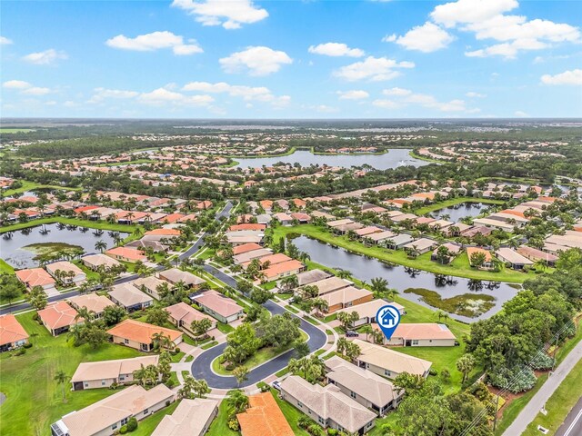 4911 Rock Island Ct, Wimauma, FL 33598 - aerial view of property and surrounding area with nearby suburban area and a nearby body of water
