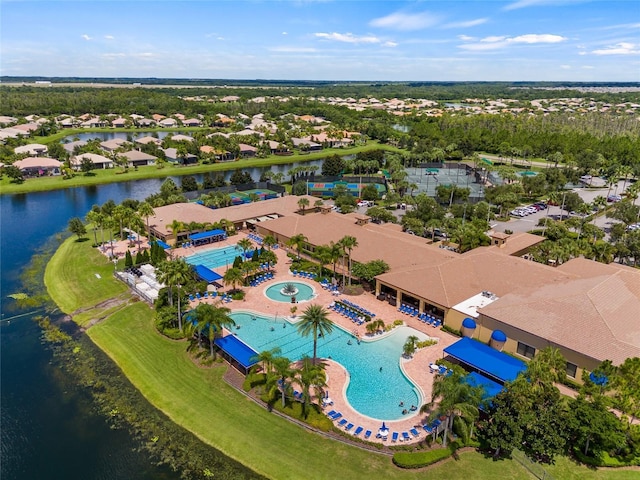 4911 Rock Island Ct, Wimauma, FL 33598 - aerial perspective of suburban area featuring a pool and a nearby body of water