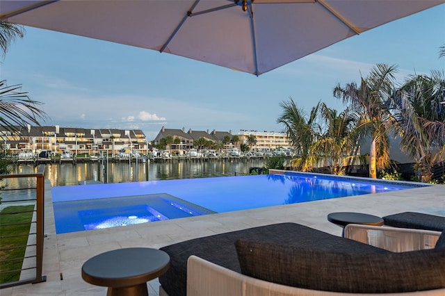 501 Barcelona Dr, Tierra Verde, FL 33715 - view of pool with an in-ground hot tub, a water view, an infinity pool, and a patio area