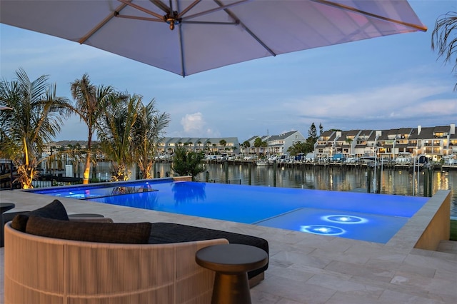 501 Barcelona Dr, Tierra Verde, FL 33715 - view of swimming pool featuring a water view, a residential view, and an infinity pool
