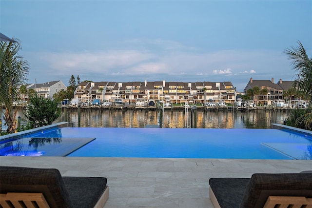 501 Barcelona Dr, Tierra Verde, FL 33715 - view of swimming pool featuring a residential view, a water view, and an infinity pool