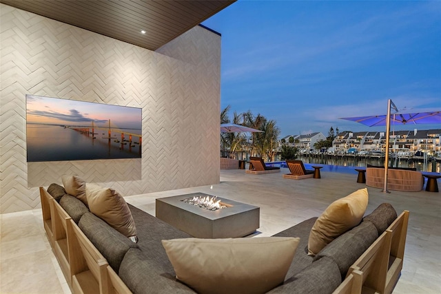 501 Barcelona Dr, Tierra Verde, FL 33715 - view of patio featuring an outdoor living space with a fire pit and a water view