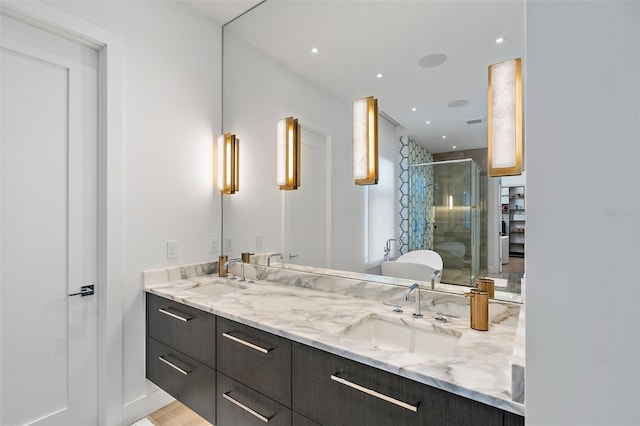 501 Barcelona Dr, Tierra Verde, FL 33715 - full bath with a stall shower, double vanity, and a freestanding tub