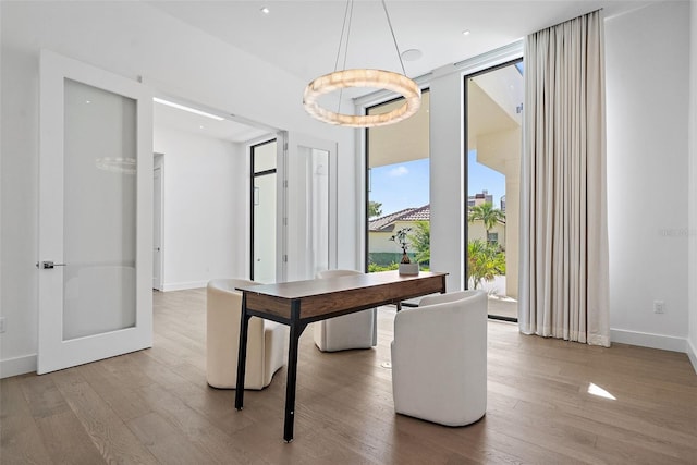 501 Barcelona Dr, Tierra Verde, FL 33715 - dining space with wood finished floors and baseboards
