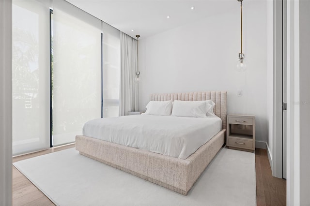 501 Barcelona Dr, Tierra Verde, FL 33715 - bedroom with light wood-style floors and recessed lighting