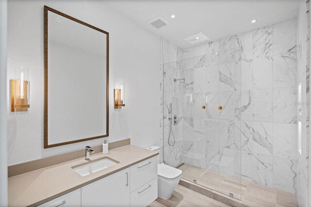 501 Barcelona Dr, Tierra Verde, FL 33715 - bathroom with vanity, a marble finish shower, and recessed lighting