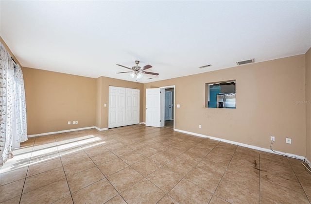 2003 Whispering Pines St, Largo, FL 33774 - empty room with a ceiling fan and tile patterned flooring