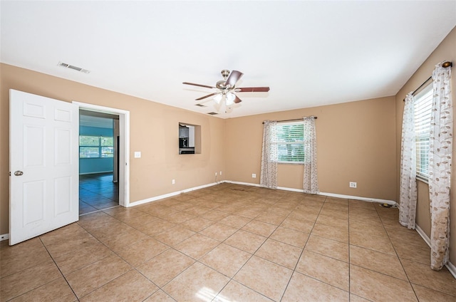 2003 Whispering Pines St, Largo, FL 33774 - spare room featuring light tile patterned flooring and ceiling fan
