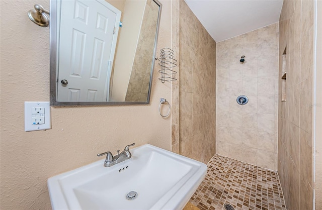2003 Whispering Pines St, Largo, FL 33774 - bathroom with a tile shower and a textured wall