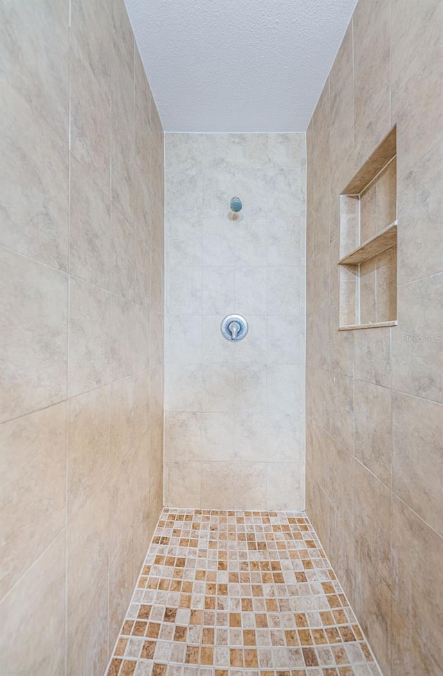 2003 Whispering Pines St, Largo, FL 33774 - full bathroom featuring tiled shower and a textured ceiling