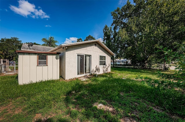 2003 Whispering Pines St, Largo, FL 33774 - back of house featuring board and batten siding