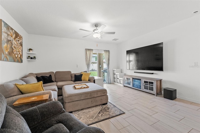 9815 Carabiner Way, Land O Lakes, FL 34637 - living area with a ceiling fan and wood tiled floors