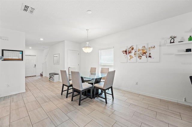 9815 Carabiner Way, Land O Lakes, FL 34637 - dining room featuring recessed lighting and wood tiled floors