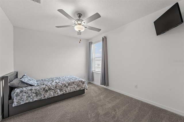 9815 Carabiner Way, Land O Lakes, FL 34637 - carpeted bedroom with baseboards and a ceiling fan