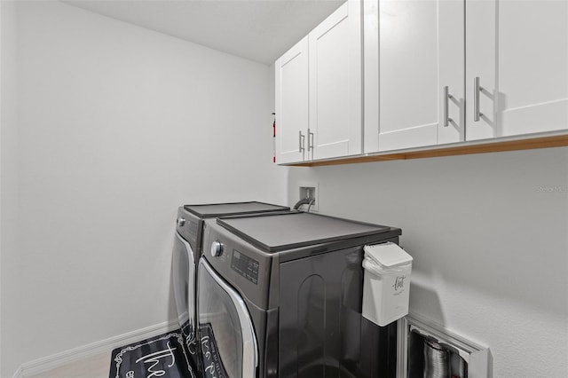 9815 Carabiner Way, Land O Lakes, FL 34637 - laundry area with cabinet space and separate washer and dryer