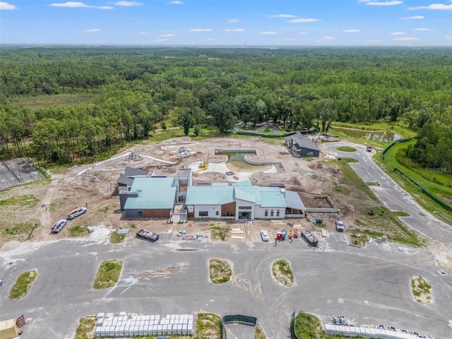 9815 Carabiner Way, Land O Lakes, FL 34637 - aerial overview of property's location featuring a heavily wooded area