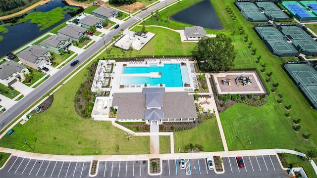 36618 Garden Wall Way, Zephyrhills, FL 33541 - aerial view of property and surrounding area featuring a pool area and a large body of water