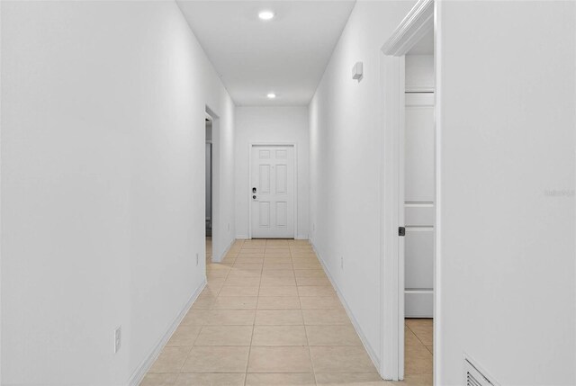 36618 Garden Wall Way, Zephyrhills, FL 33541 - corridor with light tile patterned floors and recessed lighting