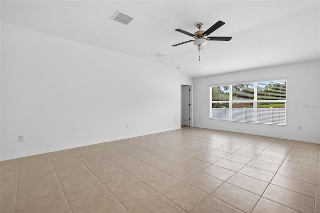 36618 Garden Wall Way, Zephyrhills, FL 33541 - spare room with vaulted ceiling, a ceiling fan, and light tile patterned flooring