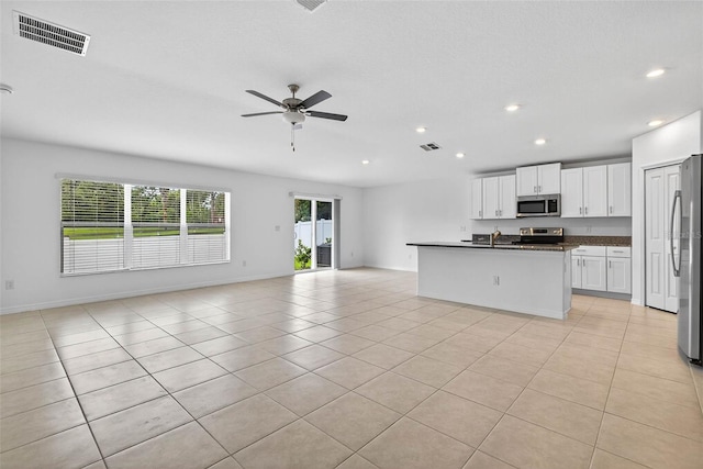 36618 Garden Wall Way, Zephyrhills, FL 33541 - kitchen with stainless steel appliances, open floor plan, dark countertops, recessed lighting, and ceiling fan