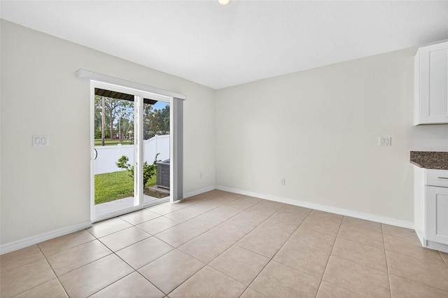 36618 Garden Wall Way, Zephyrhills, FL 33541 - empty room featuring light tile patterned flooring and baseboards