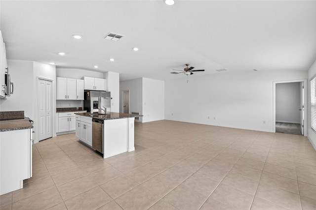 36618 Garden Wall Way, Zephyrhills, FL 33541 - kitchen with appliances with stainless steel finishes, ceiling fan, recessed lighting, light tile patterned floors, and an island with sink