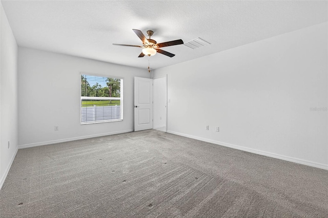 36618 Garden Wall Way, Zephyrhills, FL 33541 - carpeted spare room with ceiling fan and baseboards
