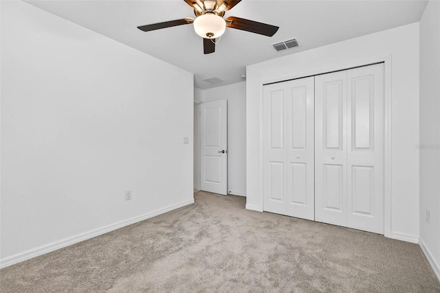 36618 Garden Wall Way, Zephyrhills, FL 33541 - unfurnished bedroom with carpet floors, a closet, and ceiling fan