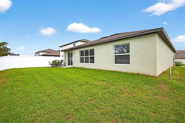 36618 Garden Wall Way, Zephyrhills, FL 33541 - back of property featuring stucco siding