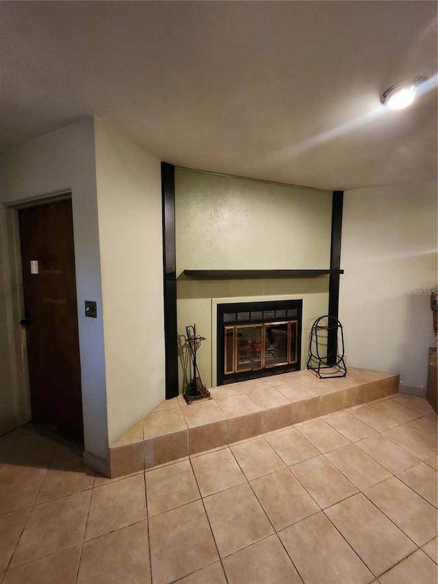 5221 82nd Ave N, Pinellas Park, FL 33781 - unfurnished living room with a tiled fireplace and tile patterned flooring