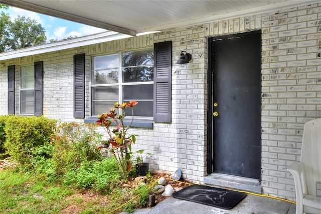 12631 Hobson Simmons Rd, Lithia, FL 33547 - property entrance with brick siding and a porch