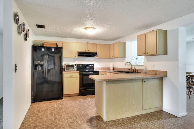 12631 Hobson Simmons Rd, Lithia, FL 33547 - kitchen featuring black appliances, a peninsula, a textured ceiling, range hood, and light countertops