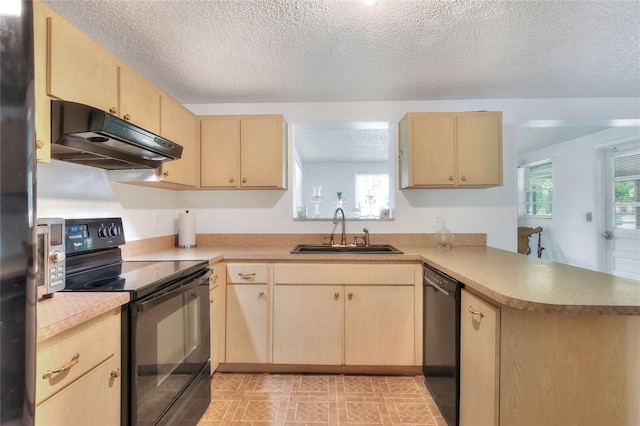 12631 Hobson Simmons Rd, Lithia, FL 33547 - kitchen with black appliances, light brown cabinetry, under cabinet range hood, a peninsula, and a textured ceiling